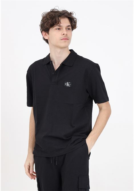 Black men's polo shirt 'TEXTURE' model CALVIN KLEIN JEANS | J30J325433BEHBEH